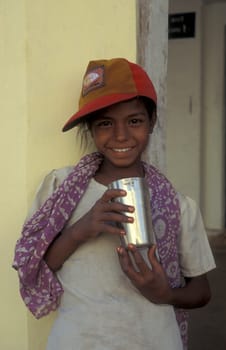 a women at a free public water station for dursty people at a shop by very hot weather in the city of Khajurao in Province Madhya Pradesh in India.  India, Khajurao, April, 1998