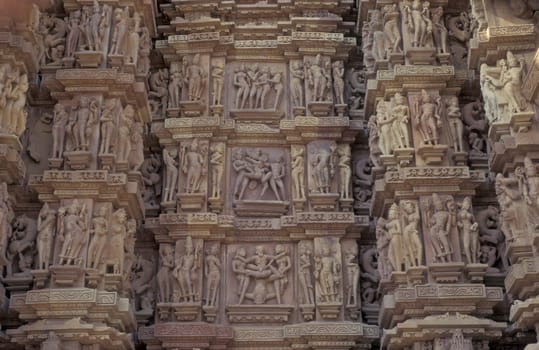 Erotic Sculptures at the erotic Temple or Hindu Temple of Kandarija Mahadeva Temple in the city of Khajurao in Province Madhya Pradesh in India.  India, Khajurao, April, 1998