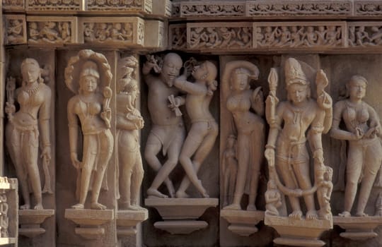 Erotic Sculptures at the erotic Temple or Hindu Temple of Kandarija Mahadeva Temple in the city of Khajurao in Province Madhya Pradesh in India.  India, Khajurao, April, 1998