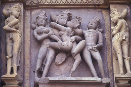 Erotic Sculptures at the erotic Temple or Hindu Temple of Kandarija Mahadeva Temple in the city of Khajurao in Province Madhya Pradesh in India.  India, Khajurao, April, 1998