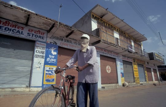 a men by very hot weather in the city of Khajurao in Province Madhya Pradesh in India.  India, Khajurao, April, 1998