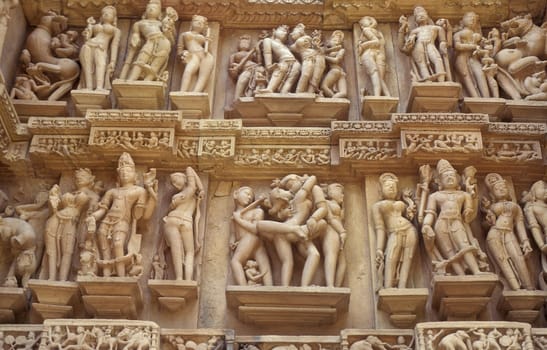 Erotic Sculptures at the erotic Temple or Hindu Temple of Kandarija Mahadeva Temple in the city of Khajurao in Province Madhya Pradesh in India.  India, Khajurao, April, 1998