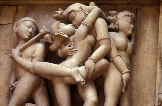 Erotic Sculptures at the erotic Temple or Hindu Temple of Kandarija Mahadeva Temple in the city of Khajurao in Province Madhya Pradesh in India.  India, Khajurao, April, 1998