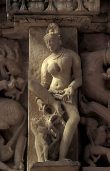 Erotic Sculptures at the erotic Temple or Hindu Temple of Kandarija Mahadeva Temple in the city of Khajurao in Province Madhya Pradesh in India.  India, Khajurao, April, 1998