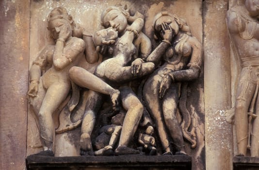 Erotic Sculptures at the erotic Temple or Hindu Temple of Kandarija Mahadeva Temple in the city of Khajurao in Province Madhya Pradesh in India.  India, Khajurao, April, 1998