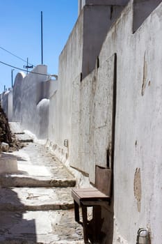 Narrow street in Pyrgos - view of streets of medieval village Pyrgos at Santorini island, Greece