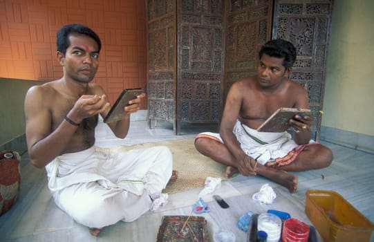 Artists at preparations get ready of a Kathakali Dance Group at a authentic training in the city of Kochi or Cochin in the Province Kerala in India.  India, Cochin, April, 1998