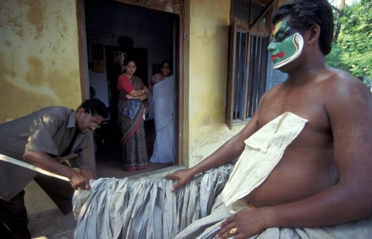Artists at preparations get ready of a Kathakali Dance Group at a authentic training in the city of Kochi or Cochin in the Province Kerala in India.  India, Cochin, April, 1998