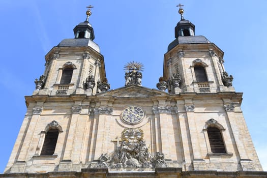 The main portal of the basilica in 91327 Gößweinstein in the Archdiocese of Bamberg in Franconian Switzerland is dedicated to the Holy Trinity. The pilgrimage church was built by Balthasar Neumann. Flags. Goessweinstein.