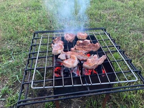 Firewood burning in the a barbecue grill