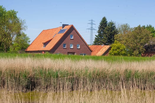 Brick residential building on the River Este, Buxtehude, Lower Saxony, Germany