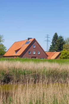 Brick residential building on the River Este, Buxtehude, Lower Saxony, Germany