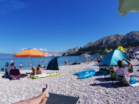 Beach scene in Baska/island Krk - water,sun,mountains  Theme picture Croatia / Hrvatska / Croatia 2024