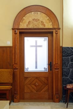 Sacristy door to the parish church of the Exaltation of the Holy Cross in Kravarsko, Croatia