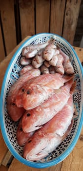 Fresh red mullets fishes stacked in a row on ice trays at the market stock instant prints background high quality down loadings
