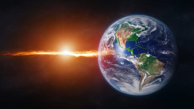View of Earth from space with sunrise lighting up the planet's surface. Ray of light from the sun reaching the planet