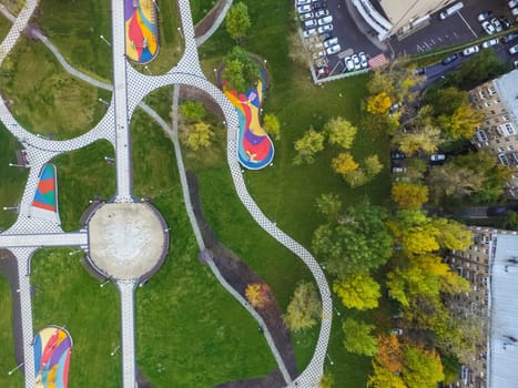 Paths in the park of paving slabs, top view of the city park