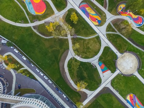 Paths in the park of paving slabs, top view of the city park
