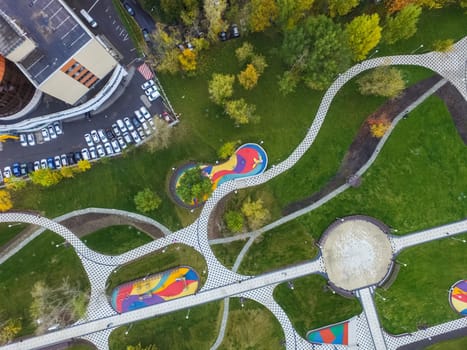 Paths in the park of paving slabs, top view of the city park