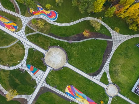 Paths in the park of paving slabs, top view of the city park