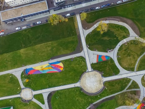 Paths in the park of paving slabs, top view of the city park