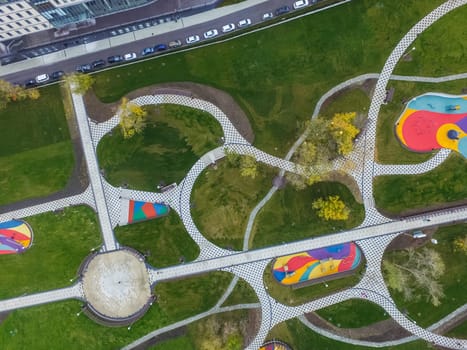 Paths in the park of paving slabs, top view of the city park