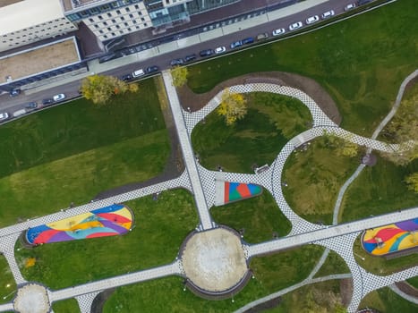 Paths in the park of paving slabs, top view of the city park