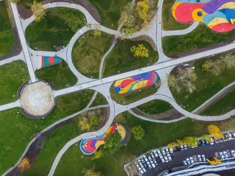 Paths in the park of paving slabs, top view of the city park