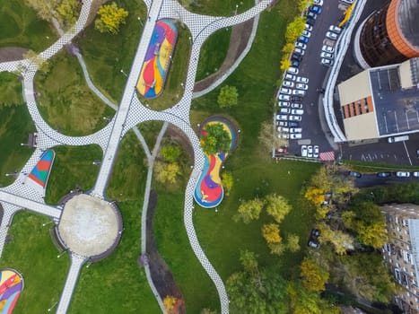 Paths in the park of paving slabs, top view of the city park