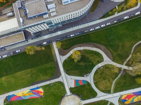 Paths in the park of paving slabs, top view of the city park