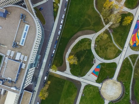 Paths in the park of paving slabs, top view of the city park