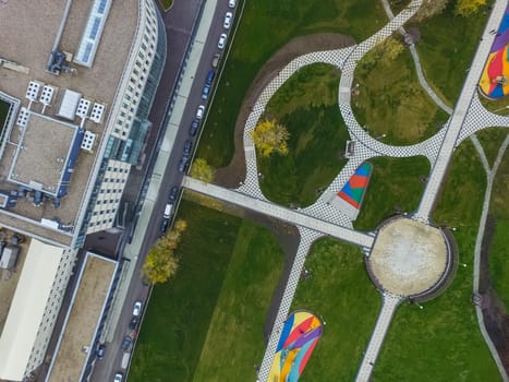 Paths in the park of paving slabs, top view of the city park