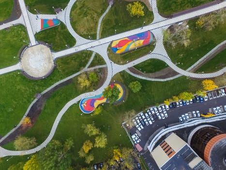 Paths in the park of paving slabs, top view of the city park