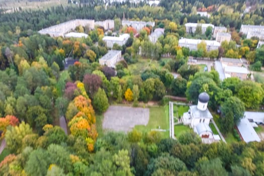 Castle in Moscow in the park. A modern Moscow castle surrounded by trees