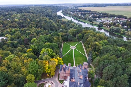 Castle in Moscow in the park. A modern Moscow castle surrounded by trees