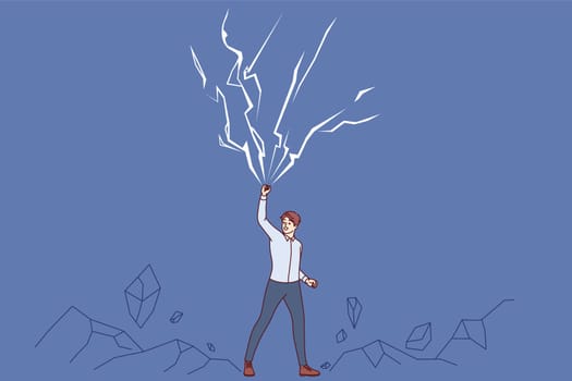 Powerful business man raises hand up near lightning bolts, demonstrating self-confidence and superpowers. Powerful entrepreneur is not afraid of natural anomalies and cataclysms that cause awe