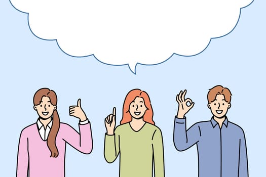 Business people make joint statement after discussion, standing under large dialogue cloud. Copy space inside dialogue bubble and office employees showing affirmative and recommendatory gestures