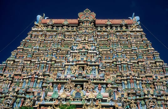 a view of the Tower of the Meenakshi Amman Temple in the city of Madurai in the Province Tamil Nadu in India.  India, Madurai, April, 1998