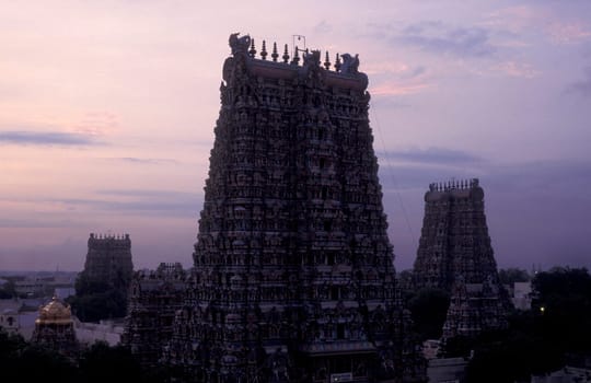 a view of the Tower of the Meenakshi Amman Temple in the city of Madurai in the Province Tamil Nadu in India.  India, Madurai, April, 1998