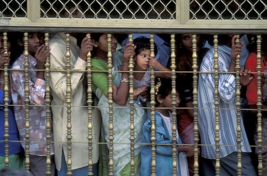 People stand in line at the entrance at the Meenakshi Amman Temple in the city of Madurai in the Province Tamil Nadu in India.  India, Madurai, April, 1998