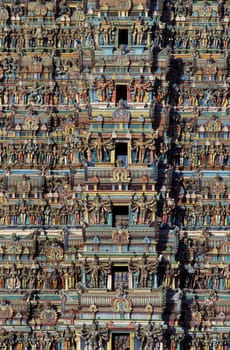 Hindu carving figures at a Tower of the Meenakshi Amman Temple in the city of Madurai in the Province Tamil Nadu in India.  India, Madurai, April, 1998