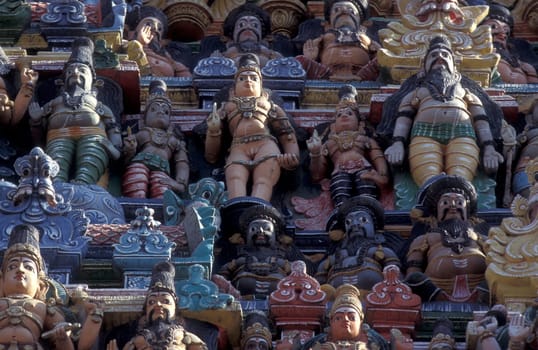 Hindu carving figures at a Tower of the Meenakshi Amman Temple in the city of Madurai in the Province Tamil Nadu in India.  India, Madurai, April, 1998