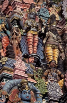 Hindu carving figures at a Tower of the Meenakshi Amman Temple in the city of Madurai in the Province Tamil Nadu in India.  India, Madurai, April, 1998