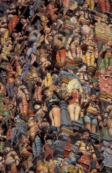 Hindu carving figures at a Tower of the Meenakshi Amman Temple in the city of Madurai in the Province Tamil Nadu in India.  India, Madurai, April, 1998
