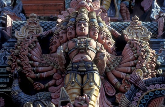 Hindu carving figures at a Tower of the Meenakshi Amman Temple in the city of Madurai in the Province Tamil Nadu in India.  India, Madurai, April, 1998