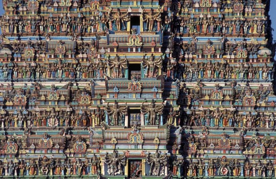 Hindu carving figures at a Tower of the Meenakshi Amman Temple in the city of Madurai in the Province Tamil Nadu in India.  India, Madurai, April, 1998