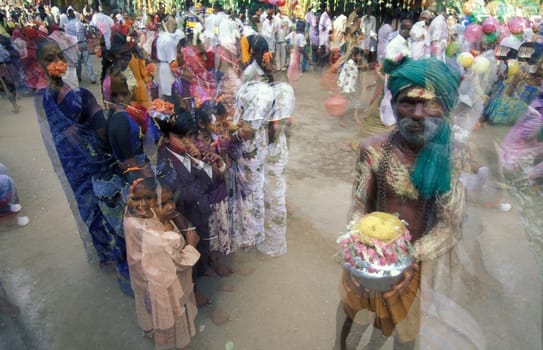 Hindu Pilgrim at a ceremony in the Meenakshi Amman Temple in the city of Madurai in the Province Tamil Nadu in India.  India, Madurai, April, 1998