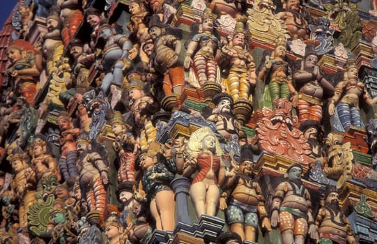 Hindu carving figures at a Tower of the Meenakshi Amman Temple in the city of Madurai in the Province Tamil Nadu in India.  India, Madurai, April, 1998