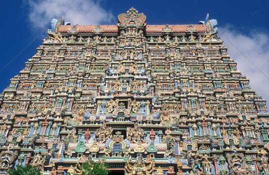 a view of the Tower of the Meenakshi Amman Temple in the city of Madurai in the Province Tamil Nadu in India.  India, Madurai, April, 1998
