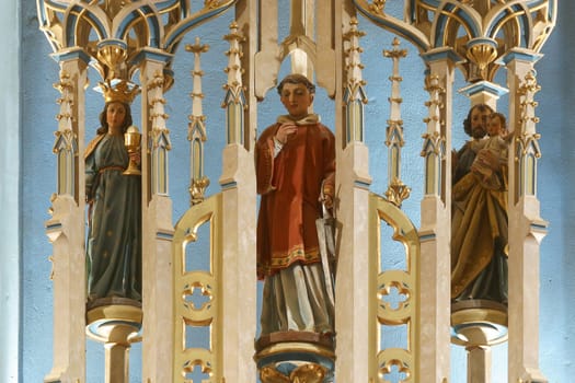 Saint Barbara, Saint Lawrence of Rome, Saint Joseph with baby Jesus, high altar in the parish church of Saint George in Desinic, Croatia